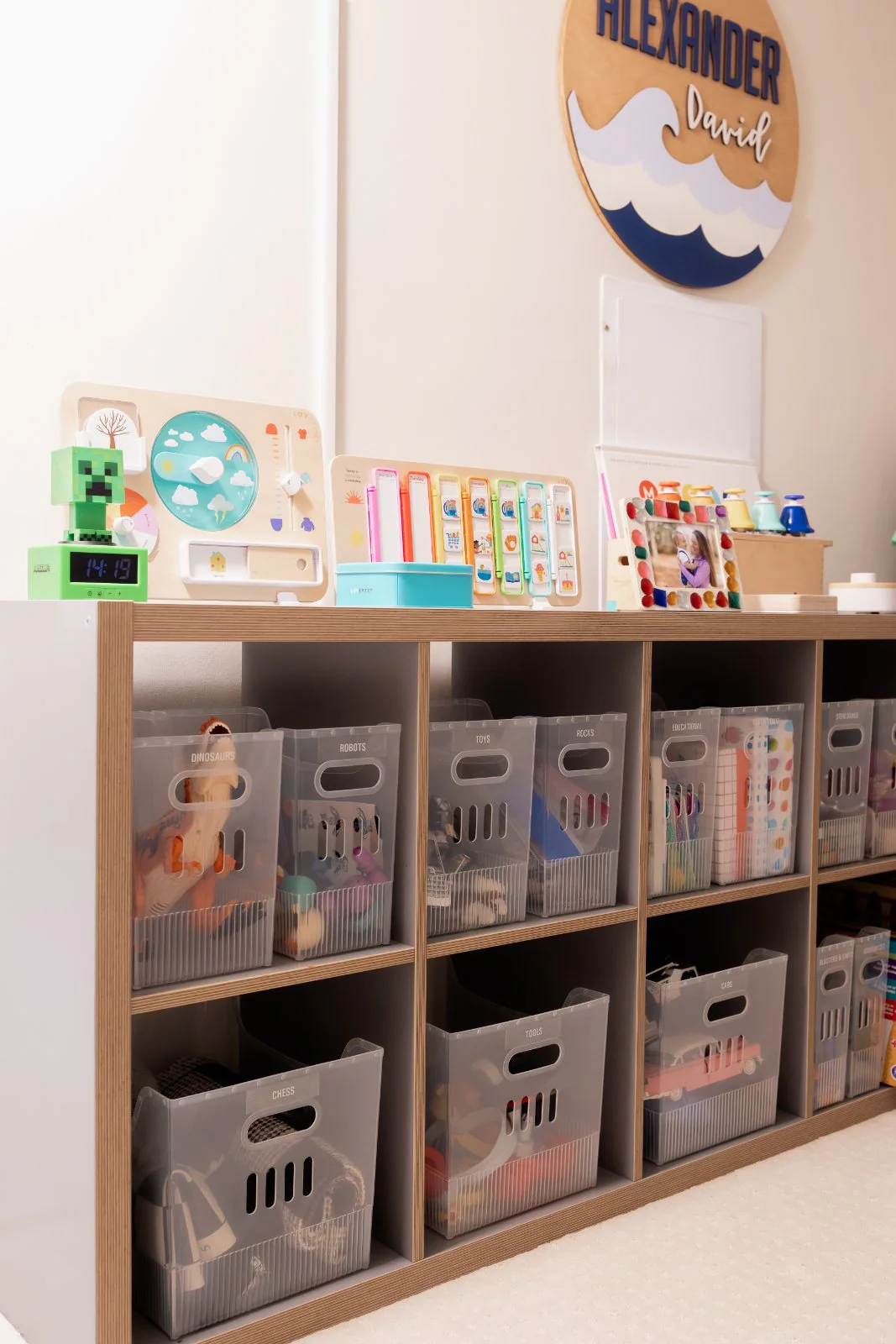 Labeled toy bins in a playroom